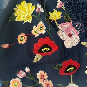 Blue mid length dress with stitched flowers